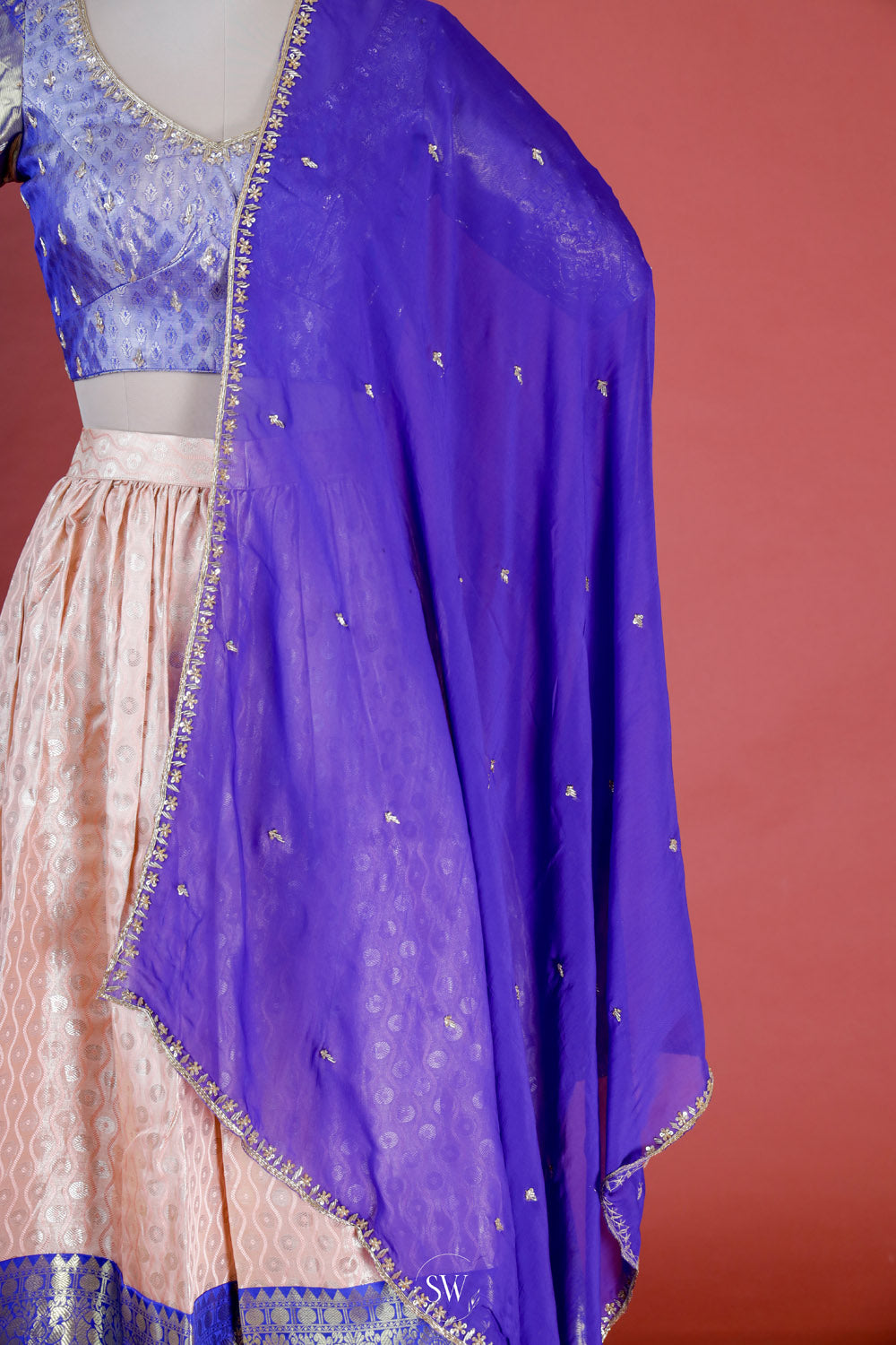 Peach Blue Silk Lehenga Set With Zari Weaving