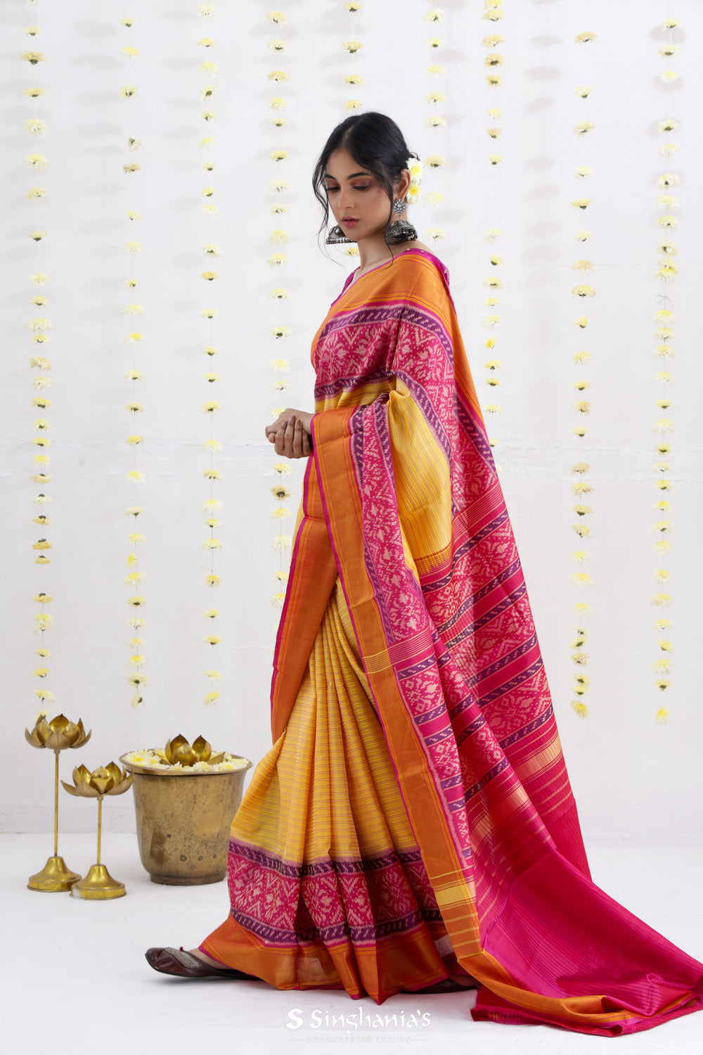 Macaroon Yellow Ikat Patola Silk Saree With Contrast Border