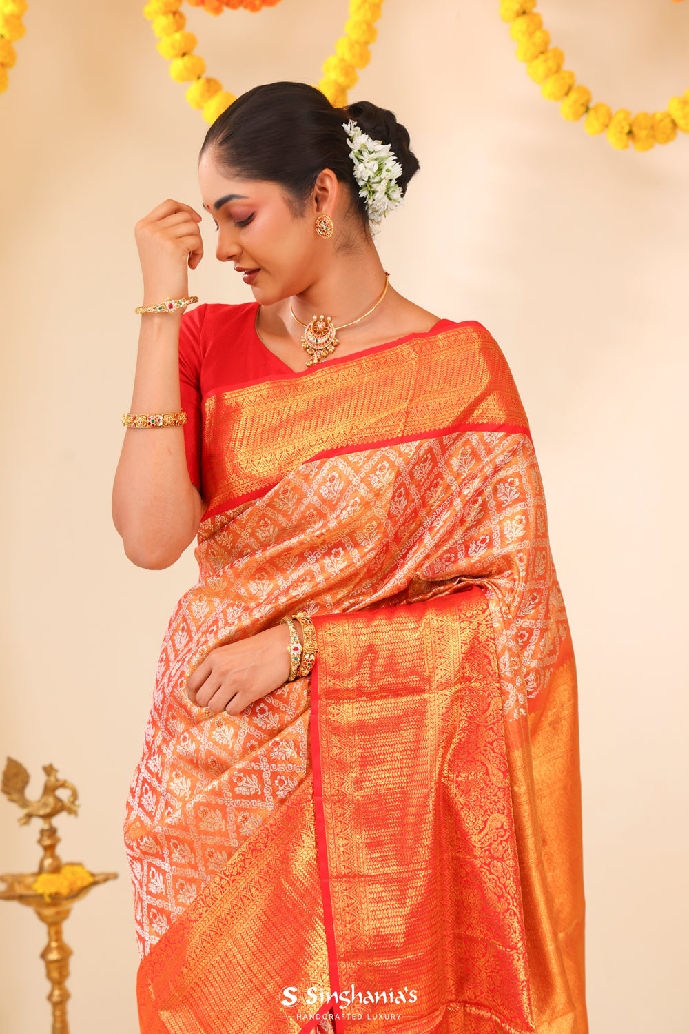 Metallic Orange Tissue Kanjivaram Saree With Floral Weaving