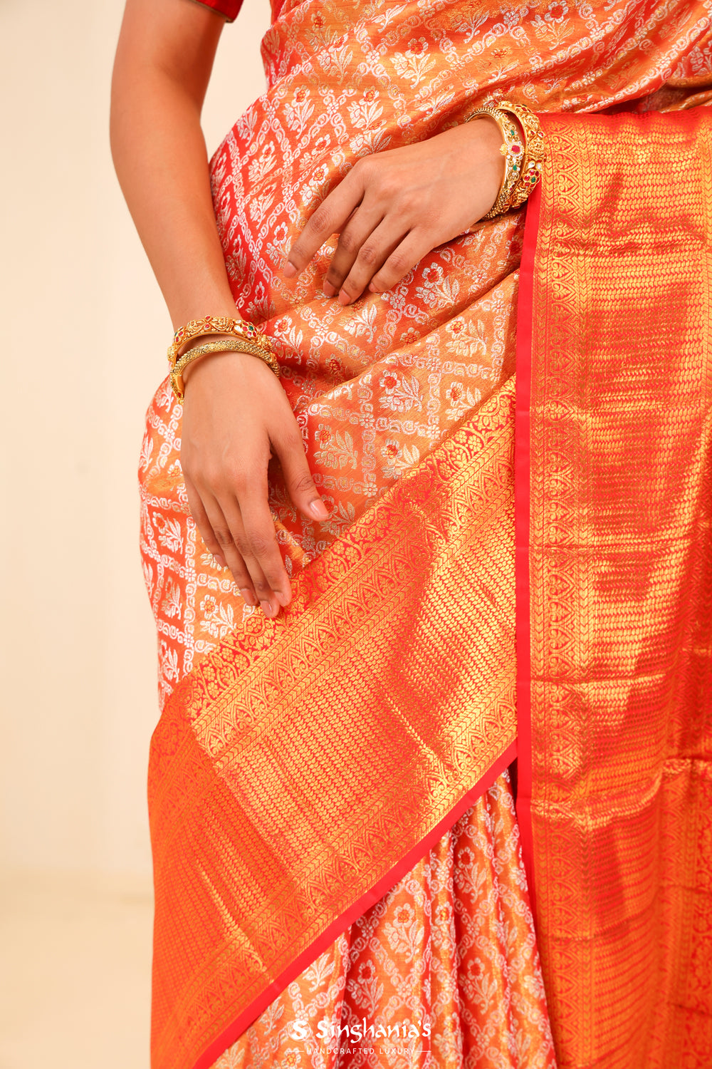 Metallic Orange Tissue Kanjivaram Saree With Floral Weaving