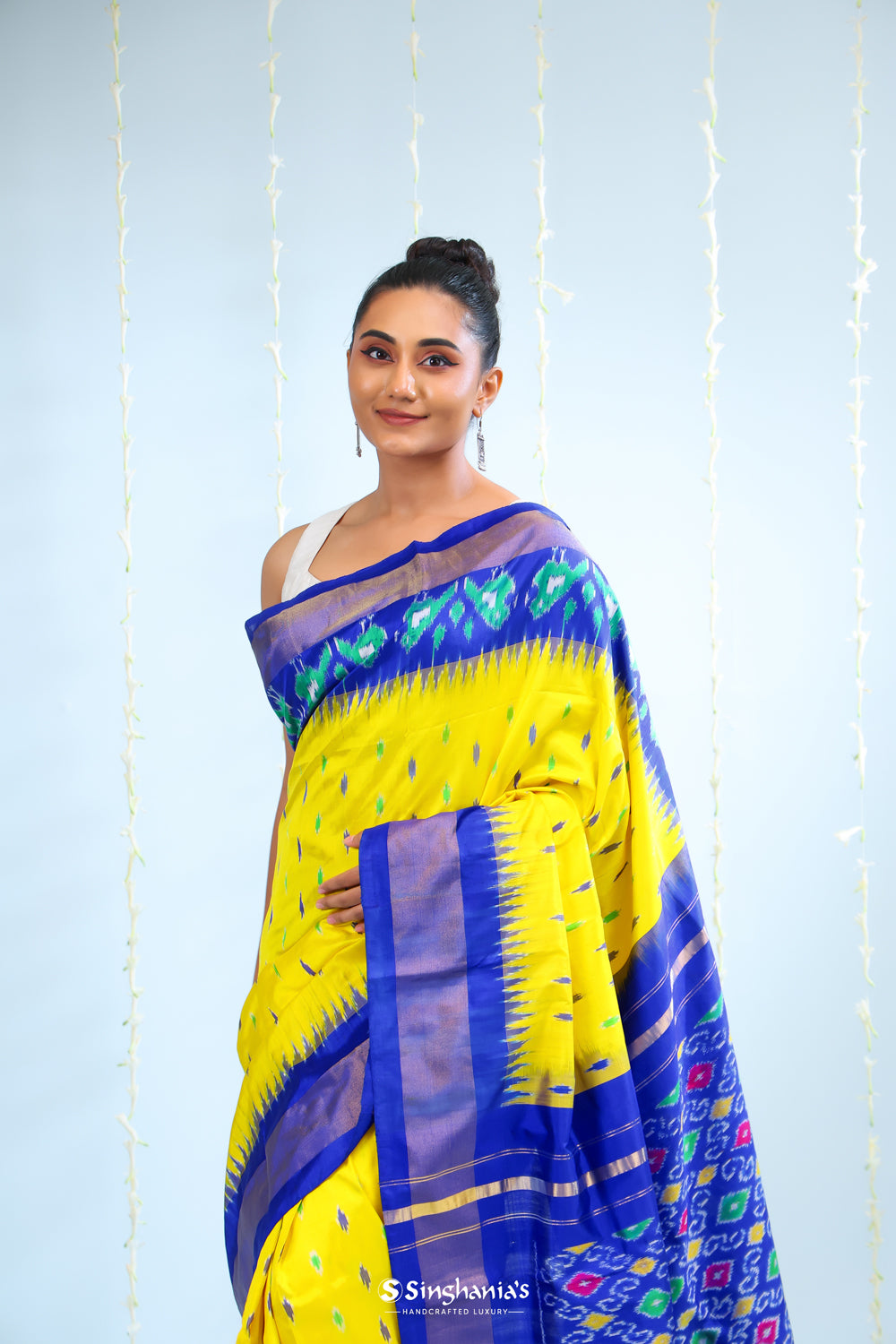 Bright Yellow Ikkat Patola Silk Saree With Contrast Border