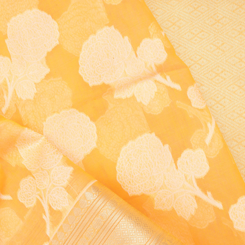 Light Orange Soft Net Saree With Floral Motifs