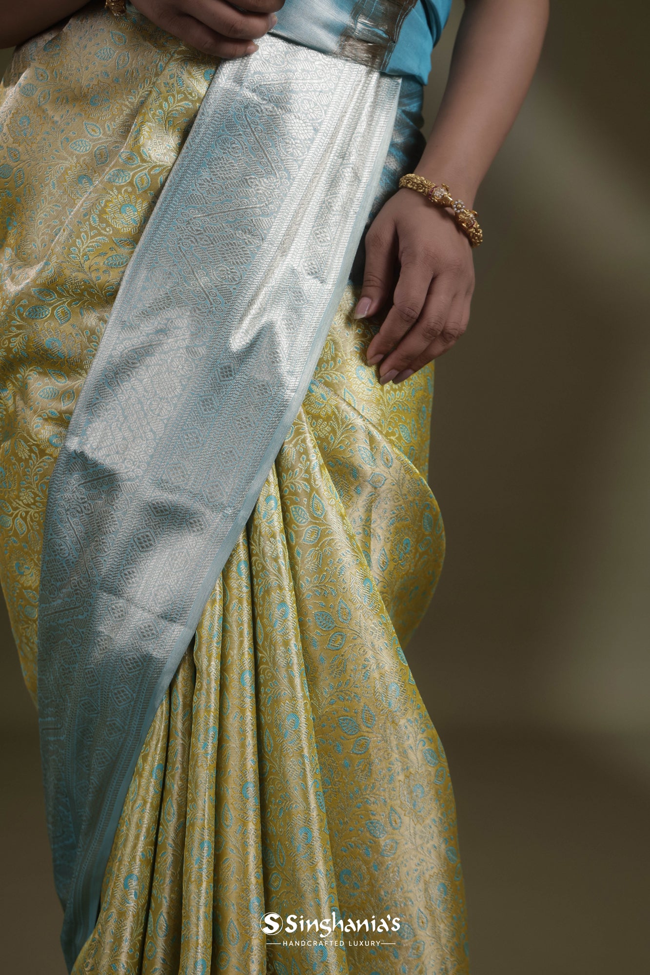 Margarita Green Tissue Kanjivaram Saree With Floral Jaal Weaving